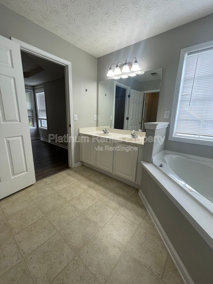 Desirable 4 bedroom floorplan featuring primary suite on the main level by Platinum Property Management Services, Inc. property image