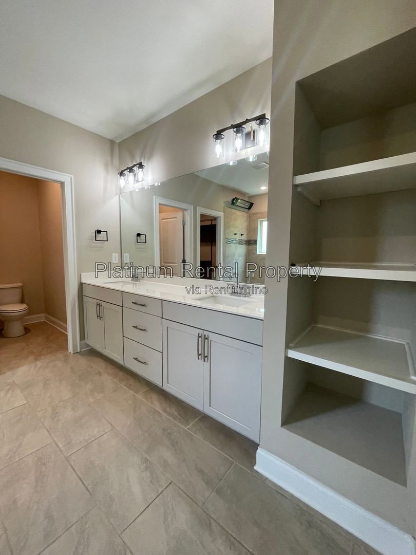Exquisite 4 bedroom home on full basement in highly sought after Forsyth county neighborhood by Platinum Property Management Services, Inc. property image