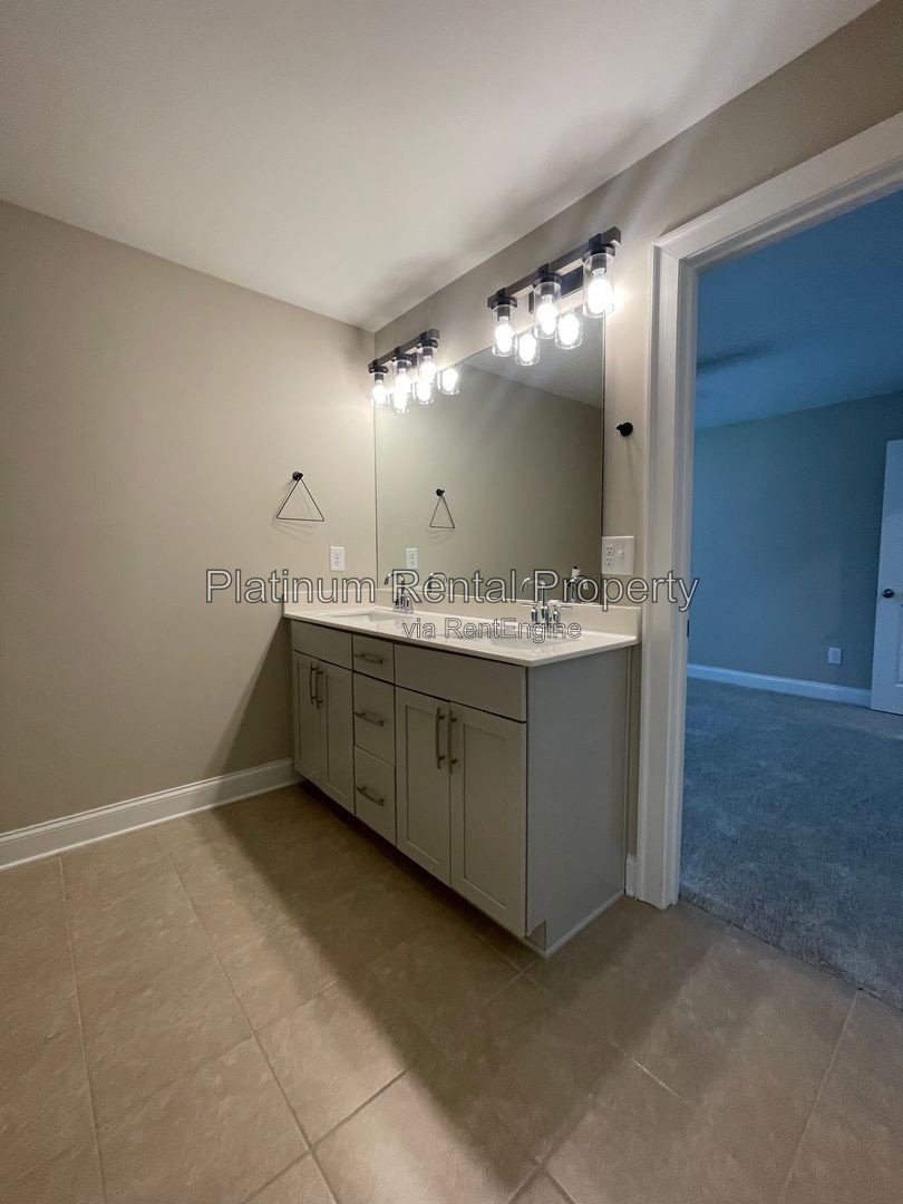 Exquisite 4 bedroom home on full basement in highly sought after Forsyth county neighborhood by Platinum Property Management Services, Inc. property image