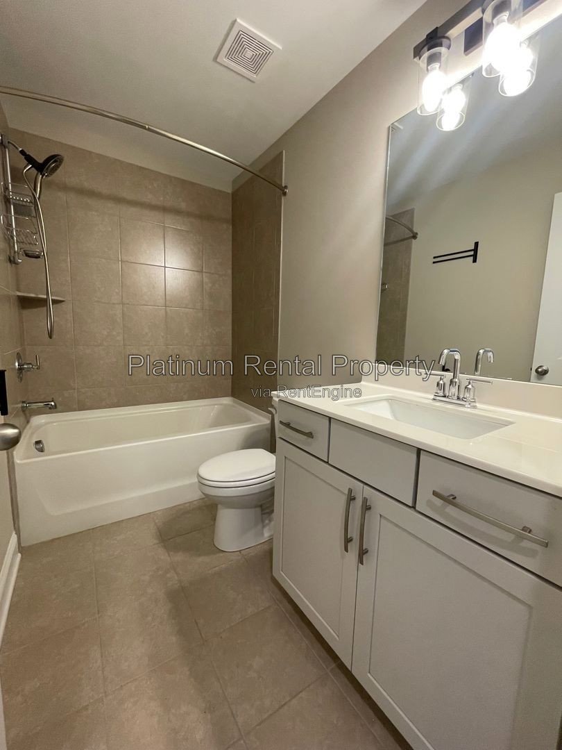 Exquisite 4 bedroom home on full basement in highly sought after Forsyth county neighborhood by Platinum Property Management Services, Inc. property image