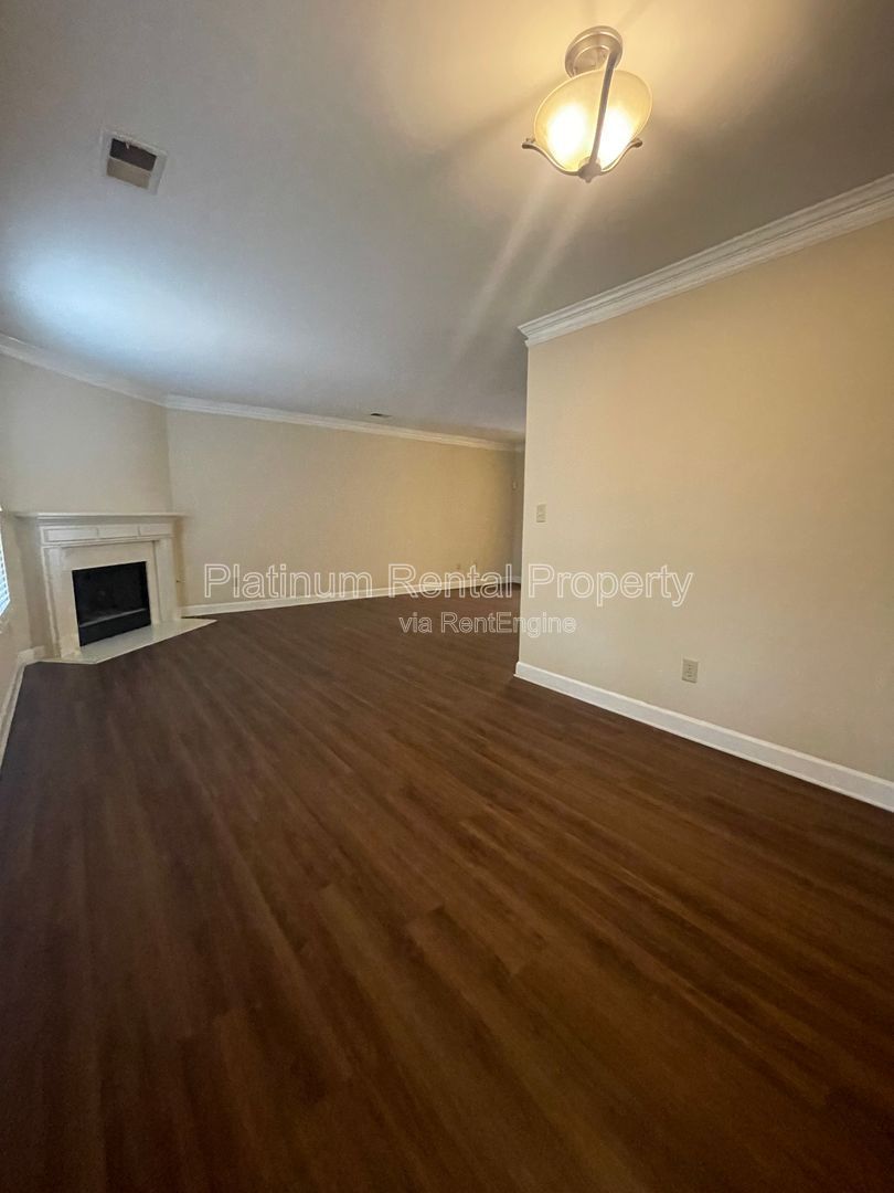 Location, Location, Location! This beautiful and well maintained three-bedroom townhome in convenient Peachtree Corners location is brought to you by Platinum Property Management Services, Inc. property image