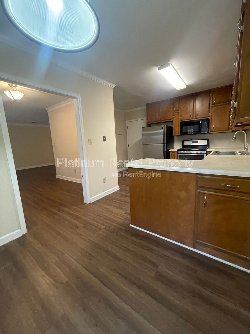 Location, Location, Location! This beautiful and well maintained three-bedroom townhome in convenient Peachtree Corners location is brought to you by Platinum Property Management Services, Inc. property image