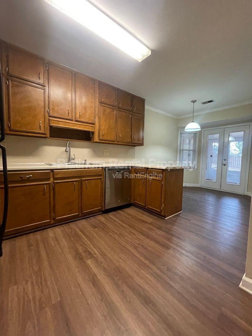 Location, Location, Location! This beautiful and well maintained three-bedroom townhome in convenient Peachtree Corners location is brought to you by Platinum Property Management Services, Inc. property image