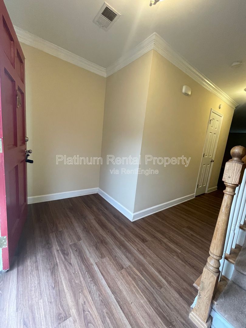 Location, Location, Location! This beautiful and well maintained three-bedroom townhome in convenient Peachtree Corners location is brought to you by Platinum Property Management Services, Inc. property image