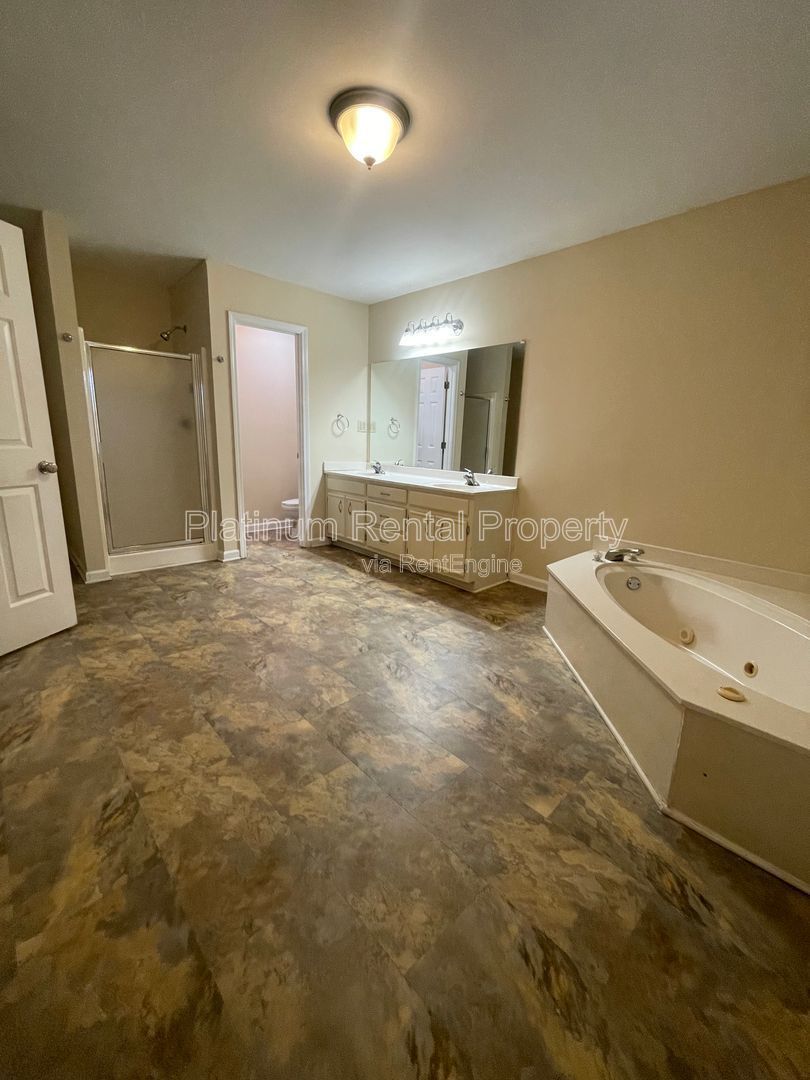 Location, Location, Location! This beautiful and well maintained three-bedroom townhome in convenient Peachtree Corners location is brought to you by Platinum Property Management Services, Inc. property image