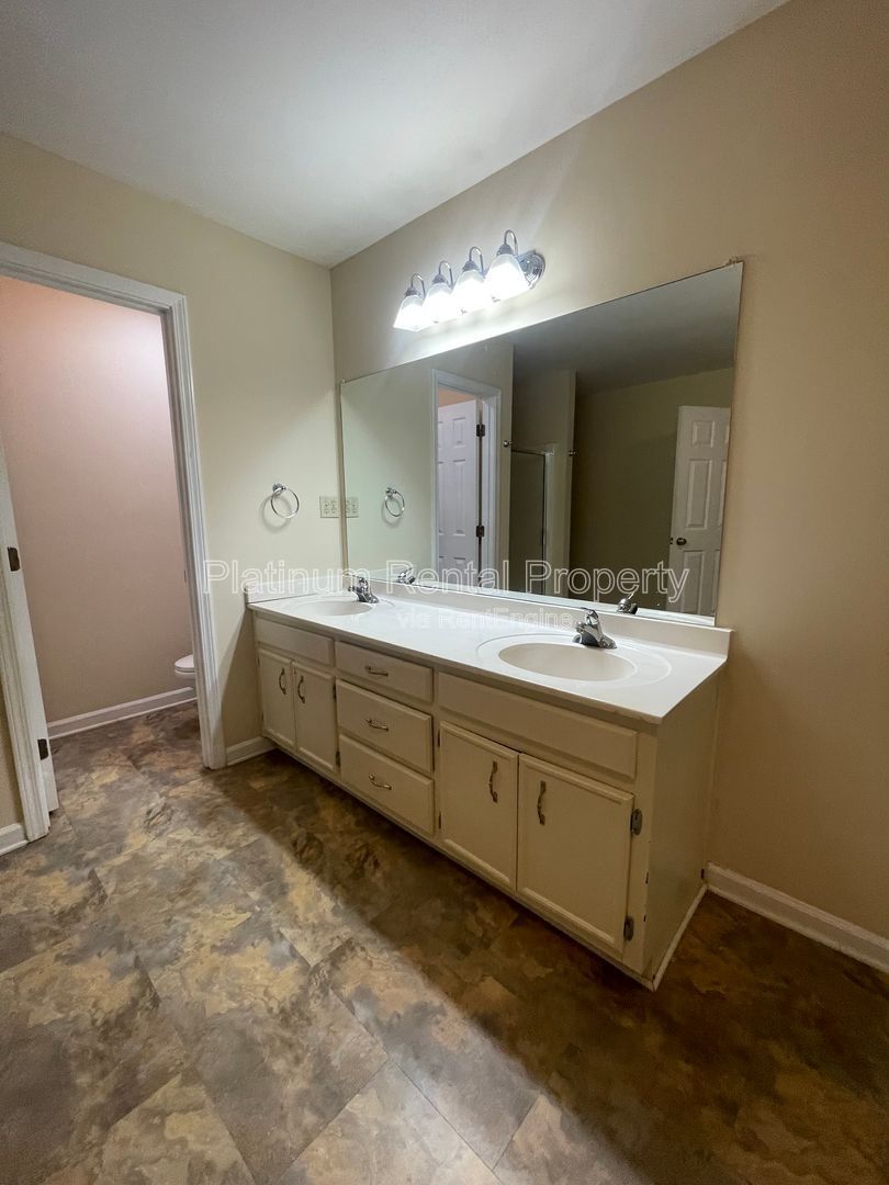 Location, Location, Location! This beautiful and well maintained three-bedroom townhome in convenient Peachtree Corners location is brought to you by Platinum Property Management Services, Inc. property image