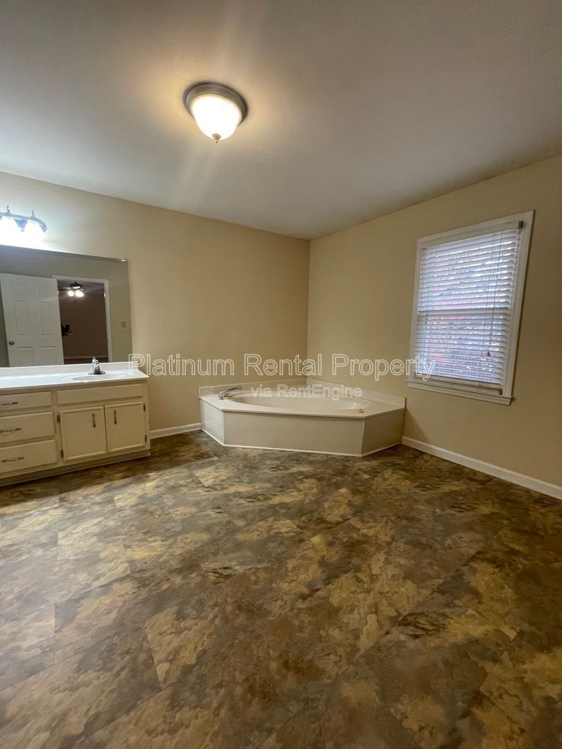 Location, Location, Location! This beautiful and well maintained three-bedroom townhome in convenient Peachtree Corners location is brought to you by Platinum Property Management Services, Inc. property image